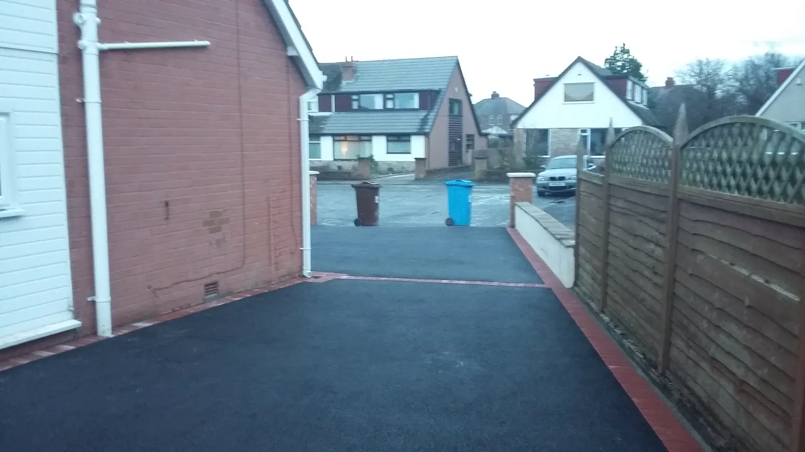 Tarmac driveway with detailed block-paved border